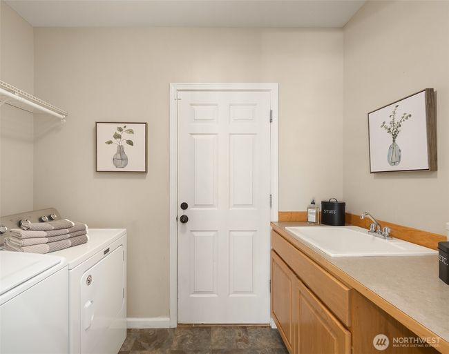 Laundry room with access to the 3 car garage | Image 18