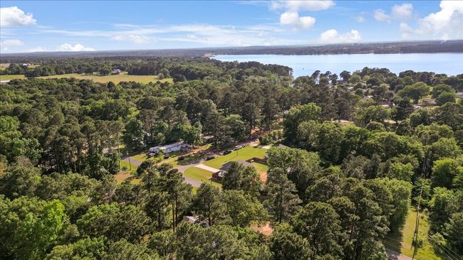 Bird's eye view featuring a wooded view and a water view | Image 38