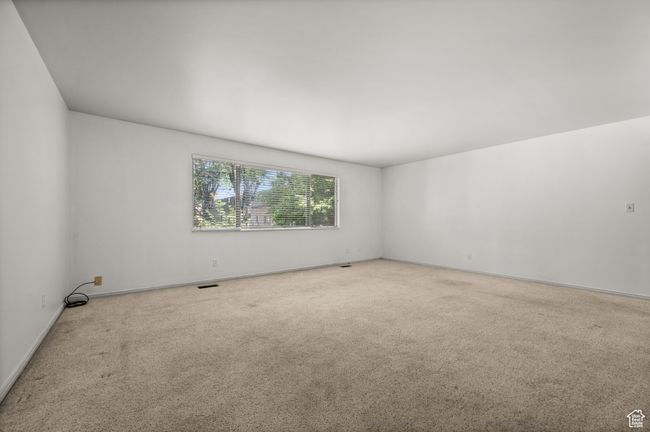 Carpeted spare room with baseboards | Image 15