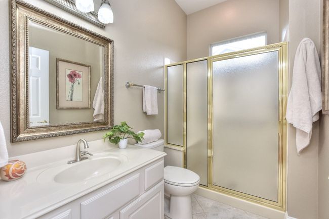 Guest bath with standing shower with seat. | Image 23