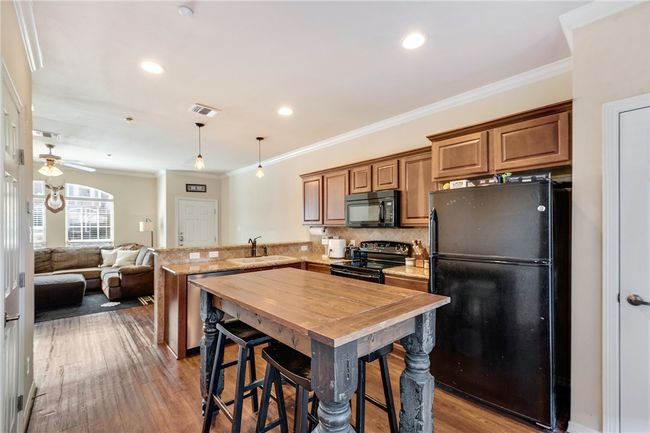 Plenty of prep space and storage including a pantry. | Image 5