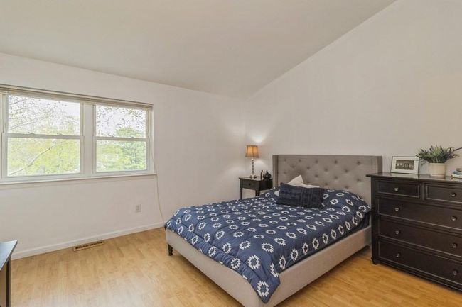 Primary bedroom with beautiful view, light wood-style floors | Image 15