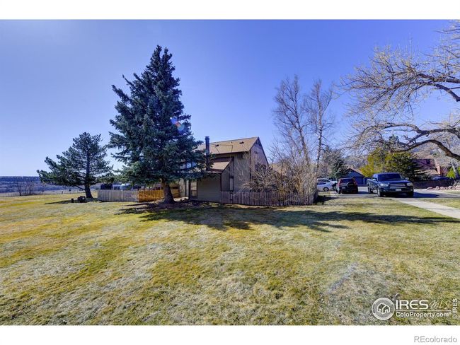 Maintenance free yard surrounds the property. | Image 28