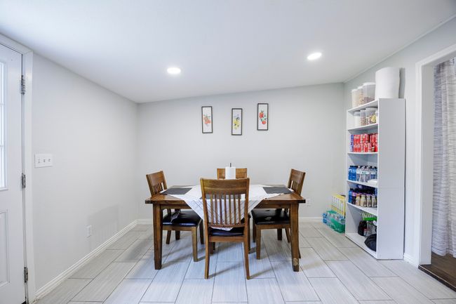 Dining room featuring recessed lighting, baseboards, and wood tiled floor | Image 9