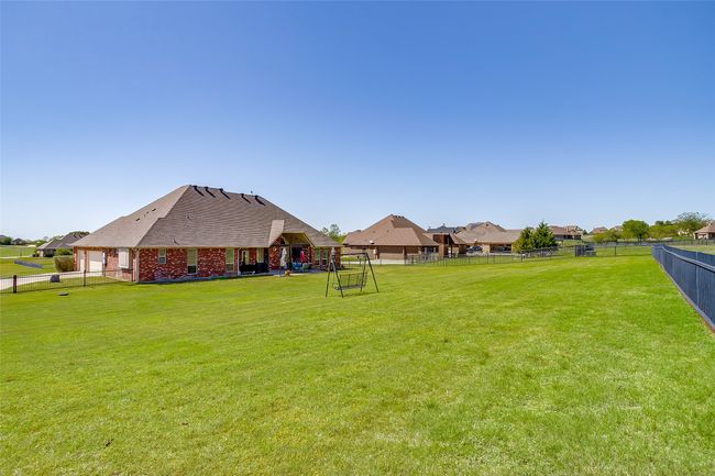View of yard with a fenced backyard and playground community | Image 32