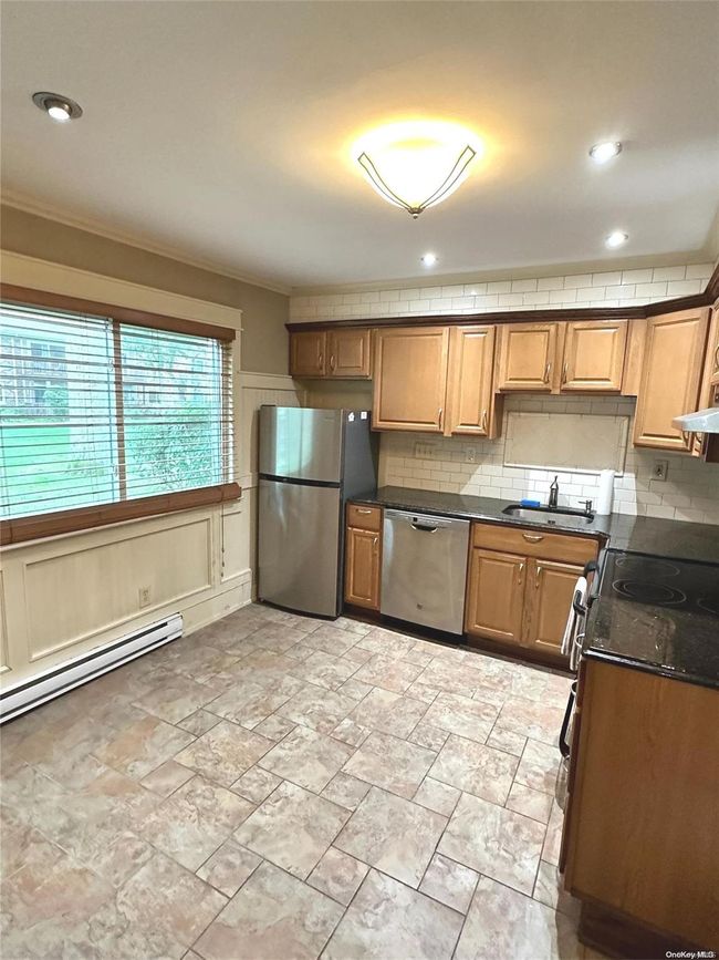 Pecan Glazed Cabinets W/ Granite | Image 8