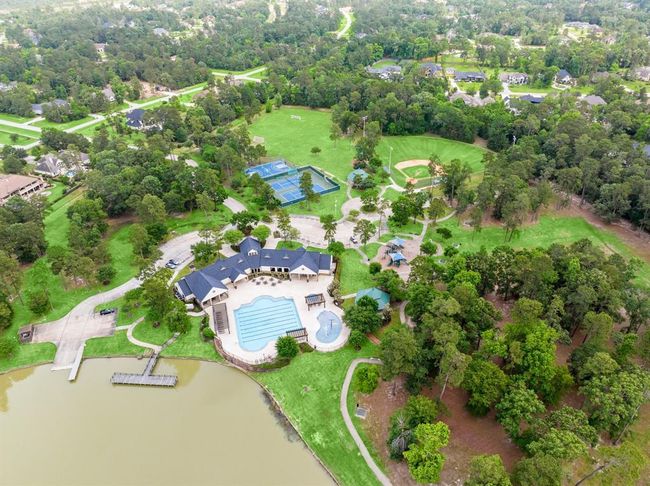 Aerial View of Clubhouse, Pool, Tennis/Pickleball Courts, Splash pad, picnic tables, baseball field, park, lake access and walking trails. | Image 28