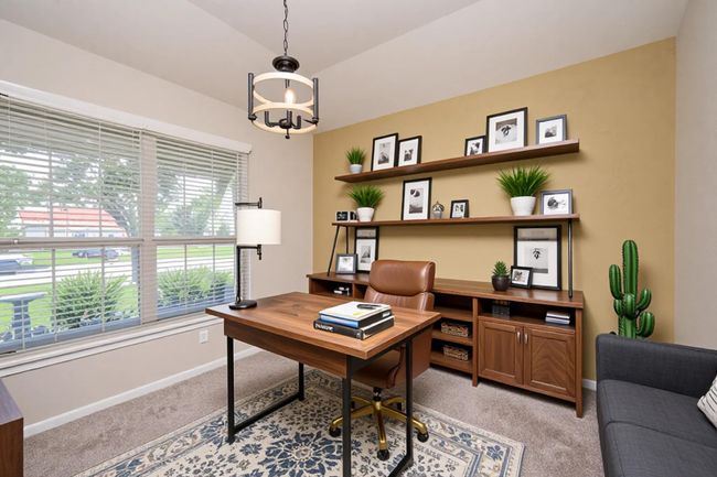 Virtual Staging. Charming home office with abundant natural light and stylish decor. Features a spacious desk, modern shelving, and cozy seating, perfect for productivity and relaxation. | Image 4