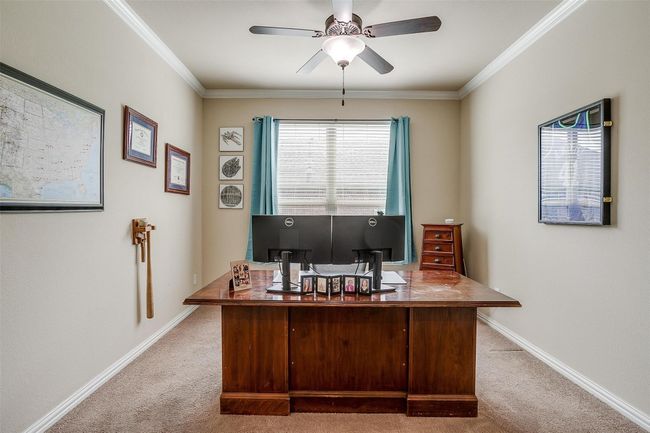 French doors, ceiling fan and bright windows. | Image 17