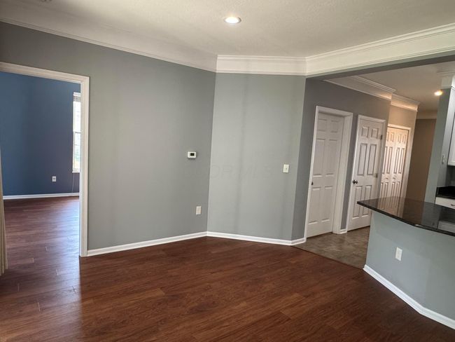 Family rm toward dining area & 2nd BR (lf) and kitchen island (rt) | Image 16