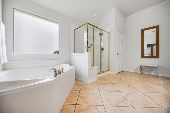 Primary bedroom ensuite features a tub, walk in shower, and 2 spacious linen closets. | Image 16