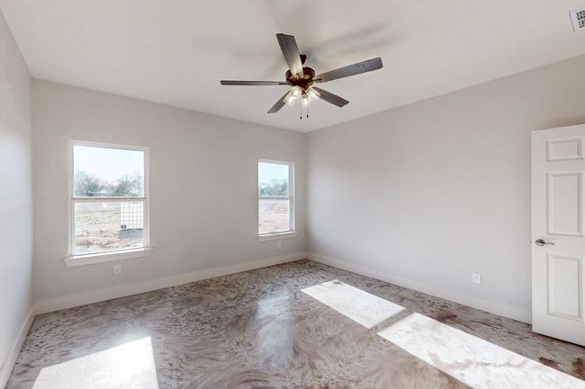 Unfurnished room featuring plenty of natural light, visible vents, baseboards, and a ceiling fan | Image 24