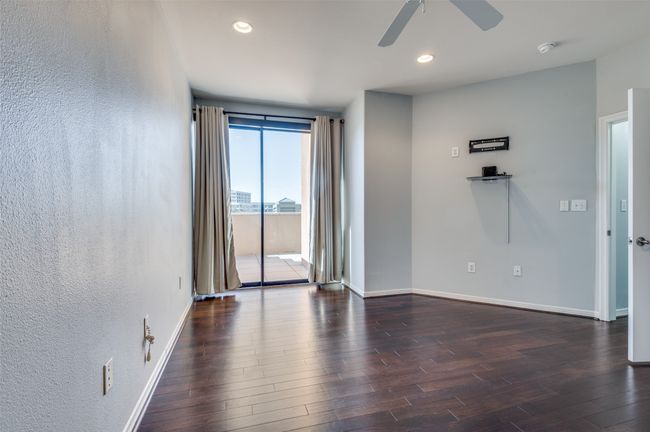 Primary bedroom has access to walk-out balcony. | Image 12