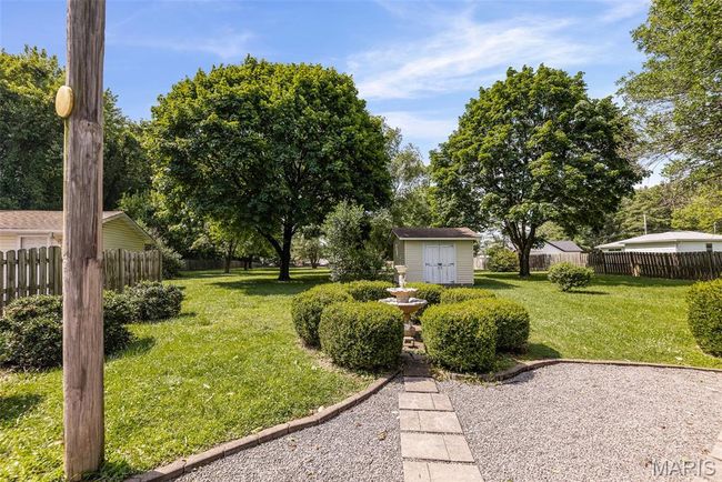 View of yard featuring a shed | Image 6