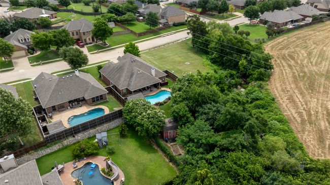 Aerial view of residential area featuring a pool area | Image 26