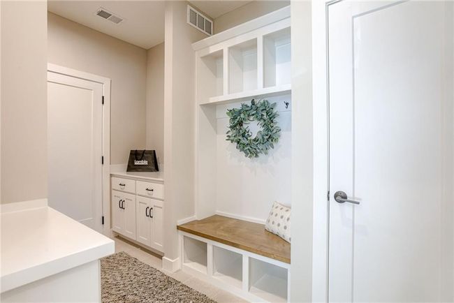 Mudroom featuring visible vents and light tile patterned floors | Image 14
