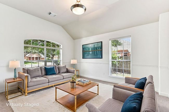 Virtually staged front living room with natural light | Image 6