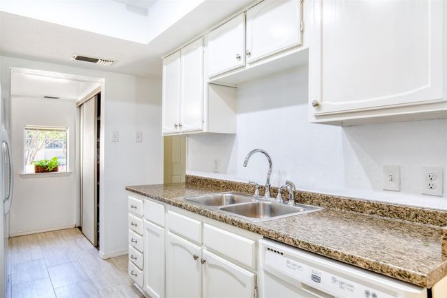 Kitchen with dishwasher and white cabinets | Image 15