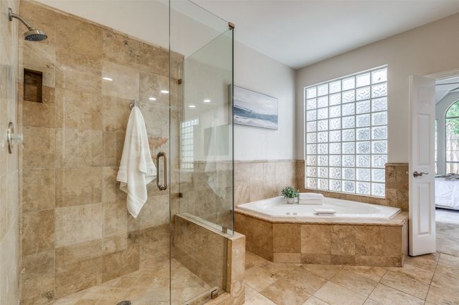 Full bathroom with a garden tub and a shower stall | Image 23