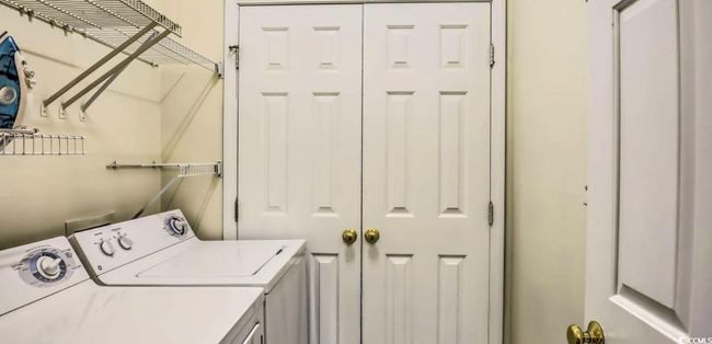 Laundry area with washer and dryer | Image 21