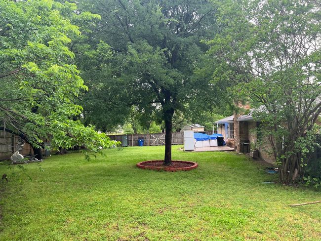 View of yard featuring a fenced backyard | Image 15