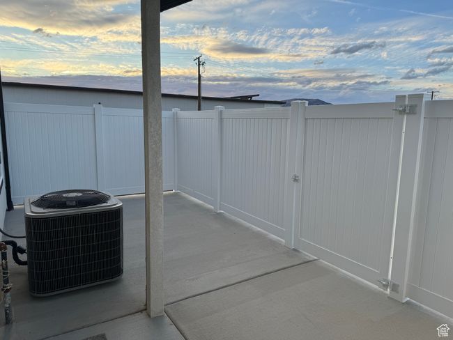 Patio terrace at dusk featuring central AC unit | Image 19