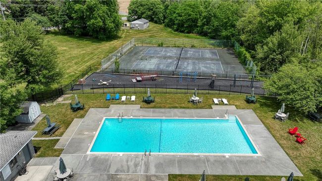View of swimming pool and tennis court | Image 31