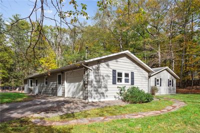 View of home's exterior with garage | Image 2