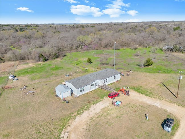 Birds eye view of property featuring a rural view and a view of trees | Image 9