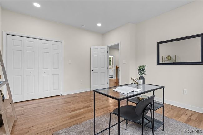 Office with light wood finished floors and recessed lighting | Image 26