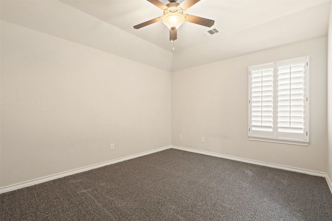 Upstairs, you'll find three spacious bedrooms. | Image 30