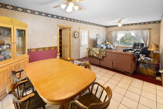 Informal dining area looking into the living room. | Image 8