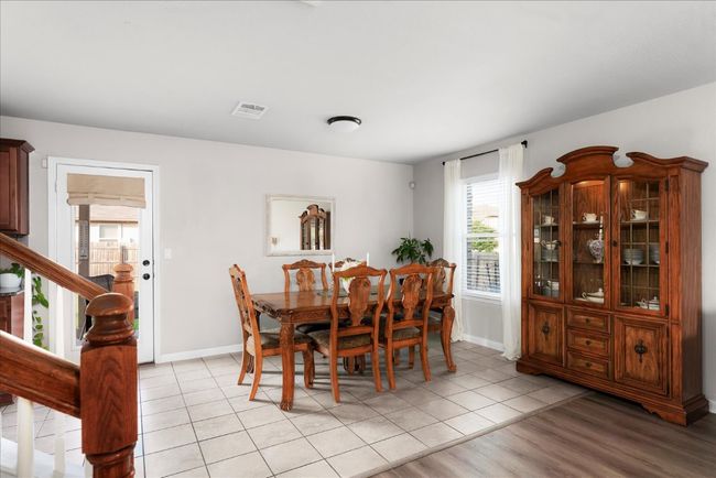 Dining space featuring baseboards and light tile patterned floors | Image 6