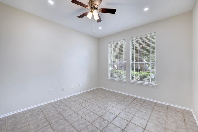 Home office on main level overlooks the front yard. | Image 16