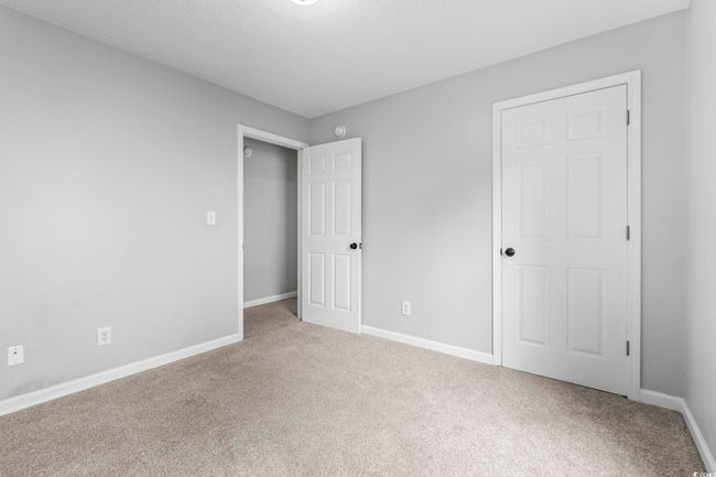 Unfurnished bedroom with carpet | Image 15