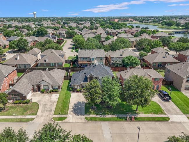 Aerial perspective of suburban area with a nearby body of water | Image 33