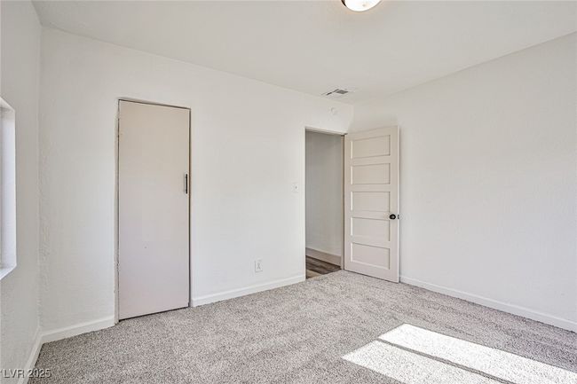 Unfurnished bedroom with carpet flooring and baseboards | Image 18