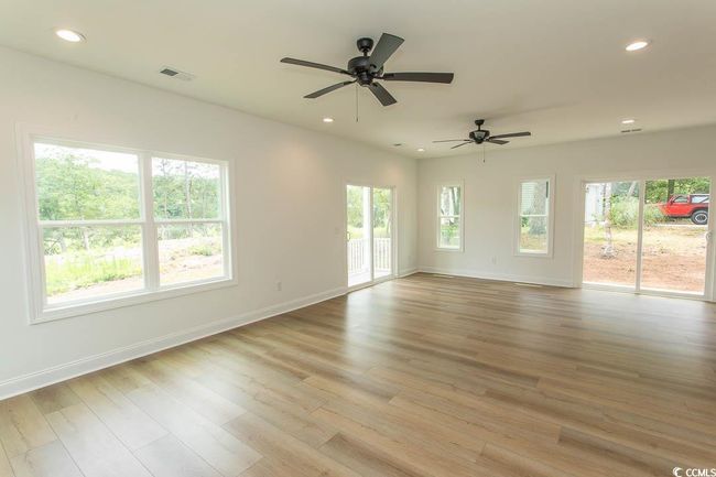 Living Room room featuring recessed lighting, baseboards, light wood-style flooring, and a ceiling fan | Image 10