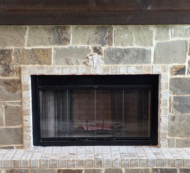 Detailed view of a fireplace with raised hearth | Image 9