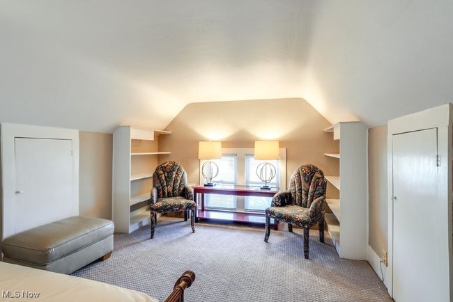 Bedroom with lofted ceiling and light carpet | Image 26