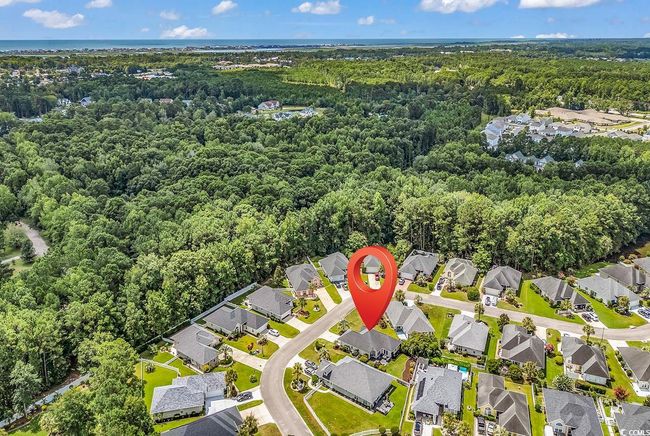 Aerial overview of property's location featuring a forest and nearby suburban area | Image 40
