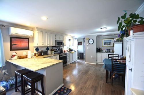 77 Village Cir W, Manorville, NY, 11949-9699 | Card Image