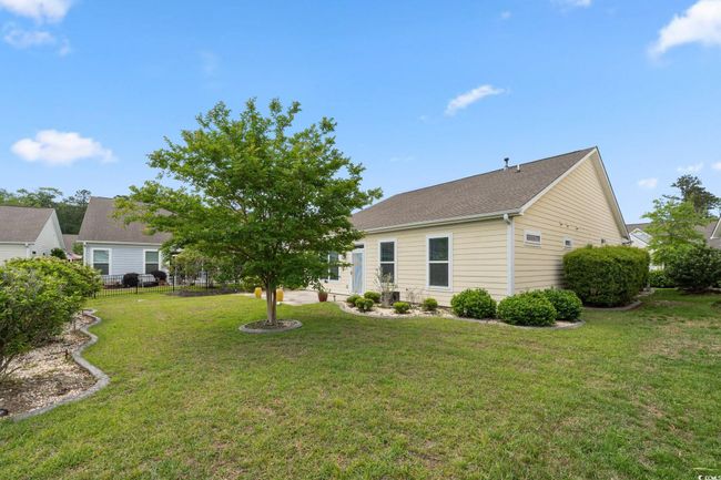 Exterior space with a lawn and a shingled roof | Image 31
