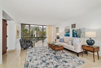 floor-to-ceiling windows flood the rooms with natural light, creating an expansive and open living area. | Image 1