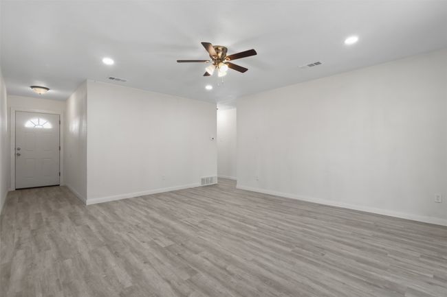 Spare room featuring ceiling fan and light hardwood / wood-style floors | Image 7