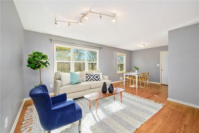 Living room with hardwood / wood-style flooring | Image 1