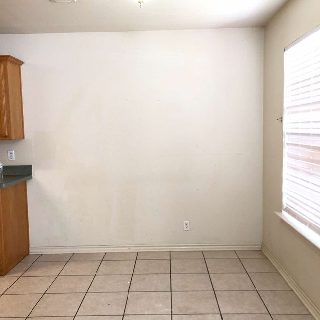 Unfurnished dining area with plenty of natural light, light tile patterned floors, and baseboards | Image 5