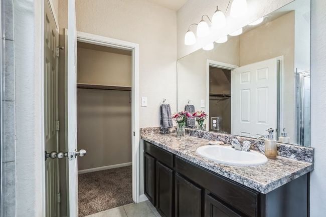 Bathroom featuring tile patterned flooring and vanity | Image 13