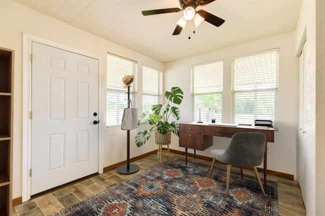 Bedroom Downstairs is Virtually Staged as an Office | Image 31