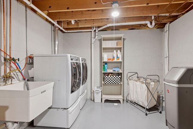 Spacious laundry room is clean and tidy | Image 17